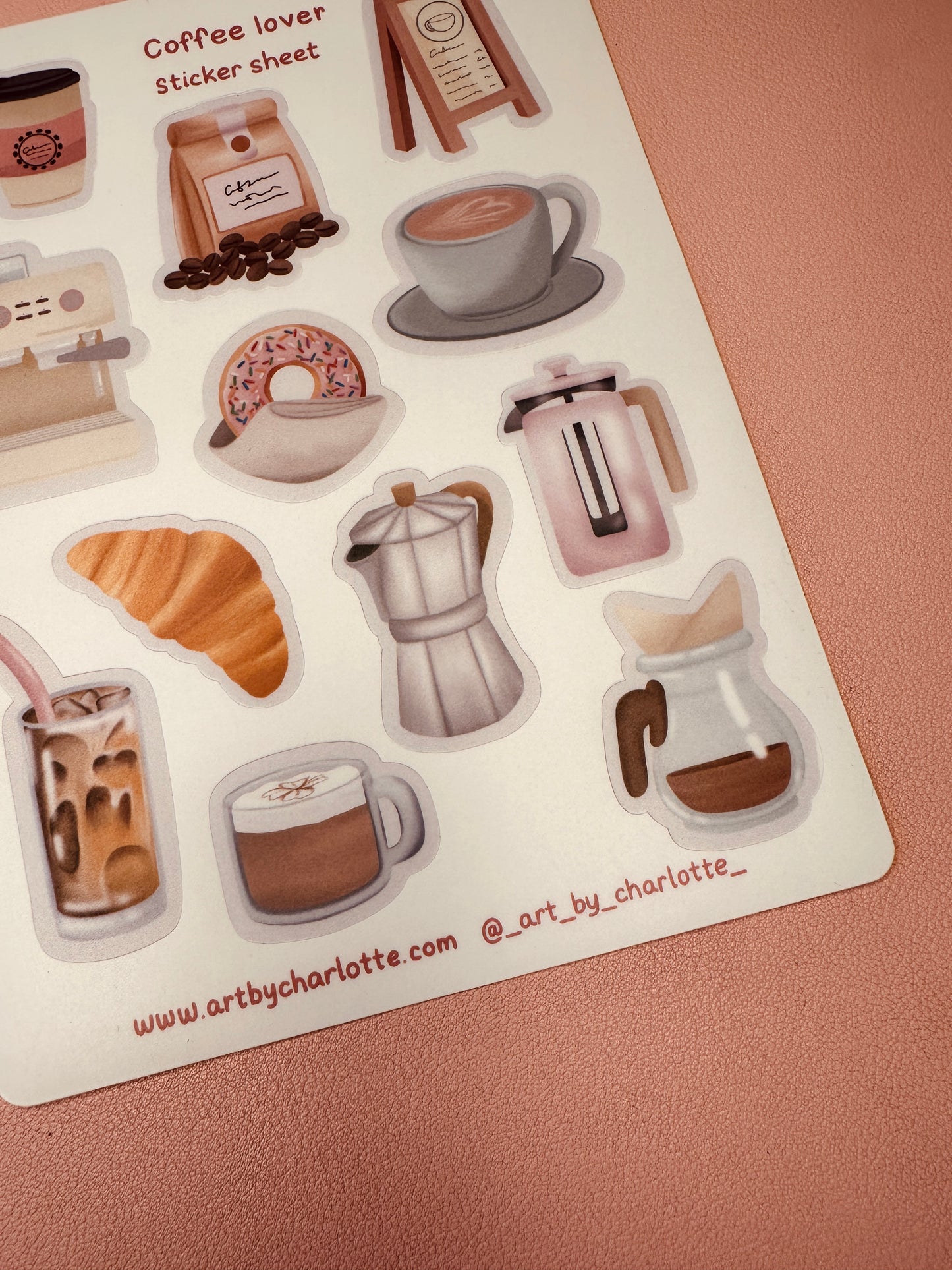 Sheet of coffee-themed stickers with various coffee-related items on a pink background.