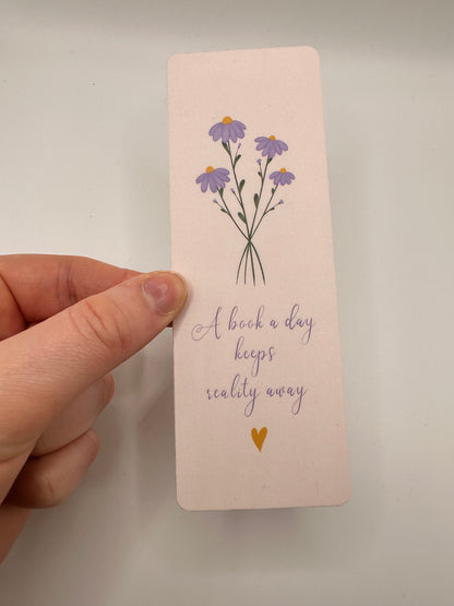 'A book a day keeps reality away' Bookmark