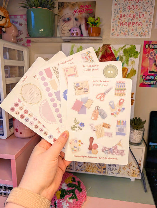 Hand holding a set of decorative sticker sheets with a colorful background